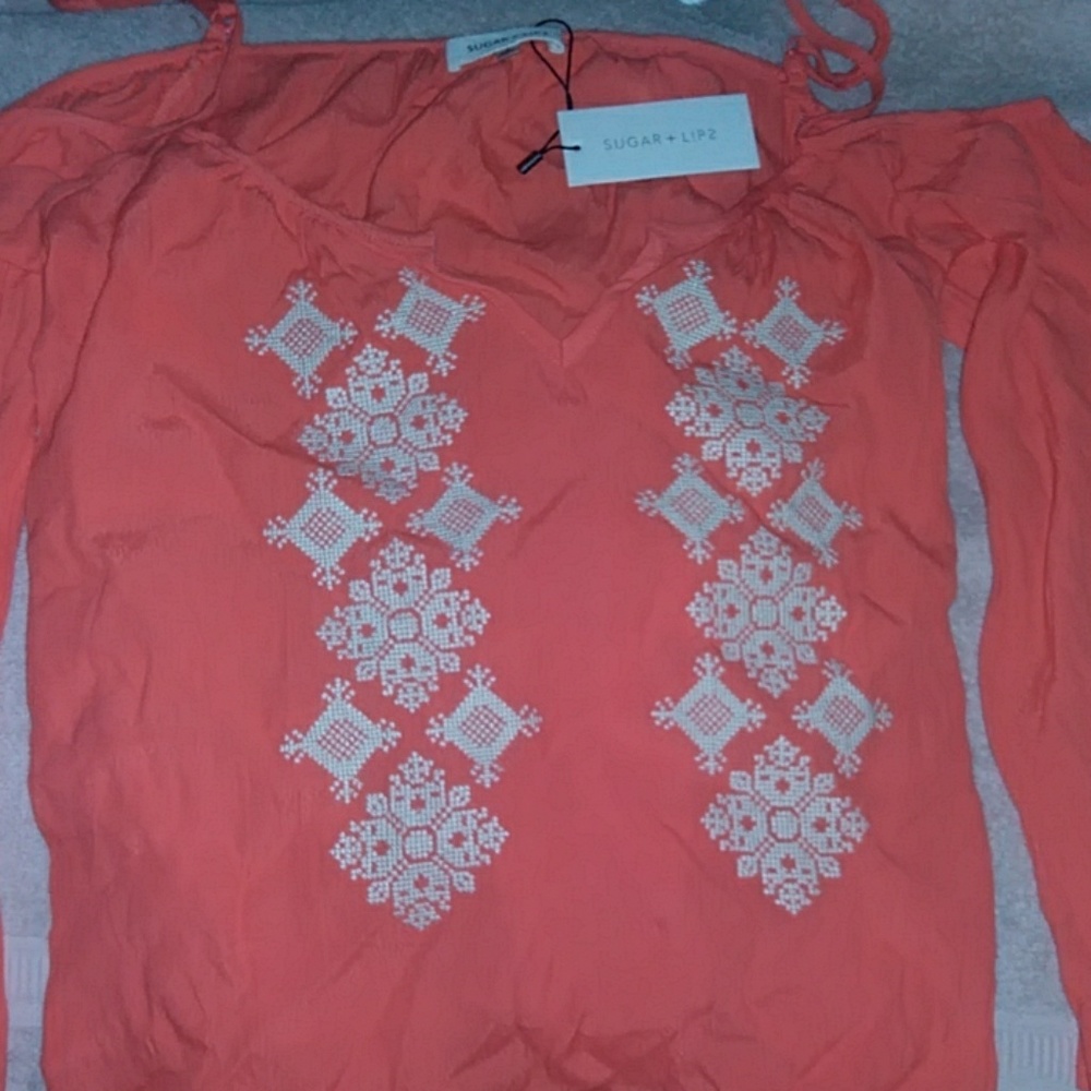 Sugar lips off the shoulders sleeved shirt.